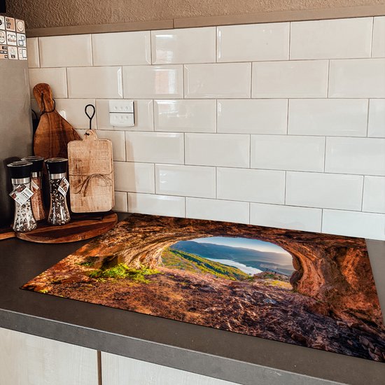 KitchenYeah® Inductie beschermer 78x52 cm - Grot - Berg - Landschap - Natuur - Kookplaataccessoires - Afdekplaat voor kookplaat - Inductiebeschermer - Inductiemat - Inductieplaat mat