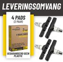 Vier zwarte V-brake remblokken en een doos met "BIKEPEAK V BRAKE SHOES MATTERHOCH 2 PAIR 70mm UNIVERSAL ALL WEATHER". Tekst: "LEVERINGSOMVANG 4 PADS (2 PAAR) GEGARANDEERD GEEN PLASTIC".
