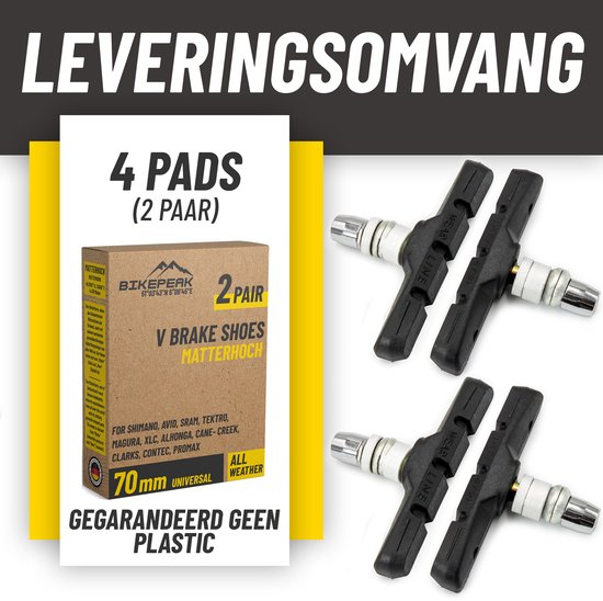 Vier zwarte V-brake remblokken en een doos met "BIKEPEAK V BRAKE SHOES MATTERHOCH 2 PAIR 70mm UNIVERSAL ALL WEATHER". Tekst: "LEVERINGSOMVANG 4 PADS (2 PAAR) GEGARANDEERD GEEN PLASTIC".