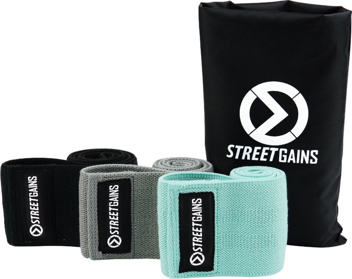 StreetGains Stoffen Weerstandsbanden Set - 3 Stuks - Ideaal voor Been Training - Booty Bands - Mini Bands - Antislip Rubberen Laag om Verschuiven te Voorkomen - Verschillende Weerstandsniveaus - Inclusief Draagtas & Trainingsgids - Fitness Banden