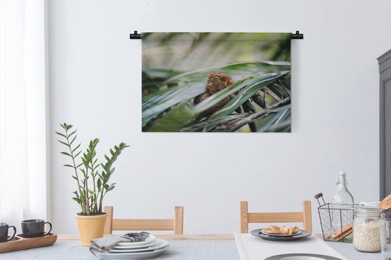 Tapisserie murale Habitants de la jungle - Tarsier des Philippines parmi les feuilles Tapisserie coton 90x60 cm - Tapisserie avec photo
