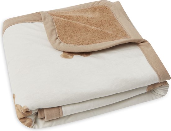 Couverture bébé blanche pliée à imprimé ours en peluche, bordée de coton marron et avec une doublure en polaire marron.