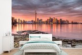 Behang - Fotobehang De stadshorizon van Toronto bij een zonsondergang in Noord-Amerika - Breedte 390 cm x hoogte 260 cm