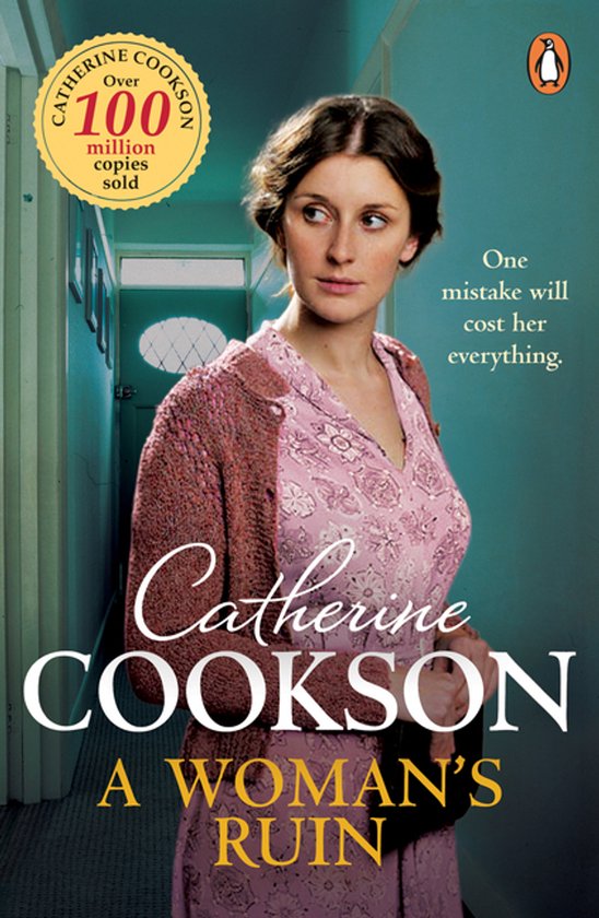Boekomslag A Woman's Ruin: vrouw in roze jurk en vest in een gang. Tekst: Catherine Cookson, meer dan 100 miljoen verkocht.