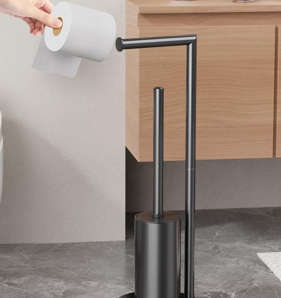 Zwarte toiletrolhouder met toiletborstel, een hand vervangt de rol.