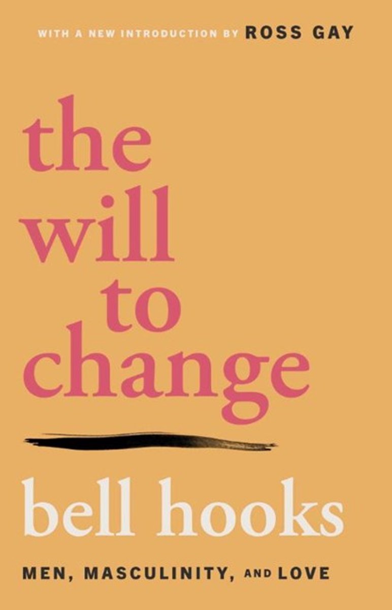 Boek "the will to change" van bell hooks, met een nieuwe inleiding van Ross Gay. Titel en ondertitel in roze en witte letters op oranje achtergrond.