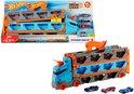 Doos met Hot Wheels Speedway Hauler speelgoed en een uitgestalde blauwe en oranje oplegger met drie speelgoedauto's.