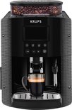 Krups volautomatische espressomachine in het zwart, met bonenreservoir en een kopje espresso.