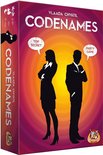 Doos van Codenames met silhouetten van een man en vrouw, met tekst 'Top Secret' en 'Party Game'.