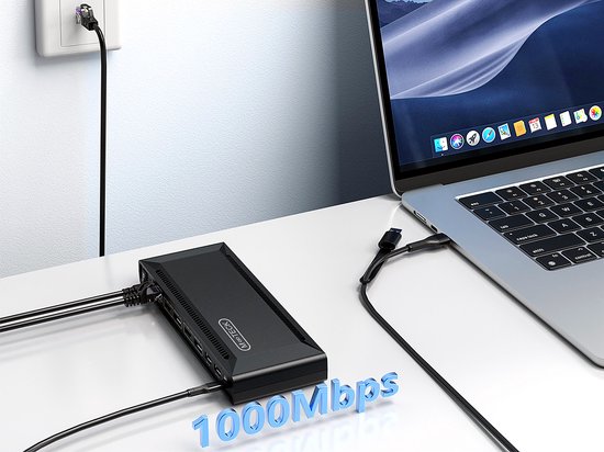 Een M-TECK dockingstation, aangesloten op een laptop via USB-C, met een 1000Mbps Ethernet-verbinding naar de muur.