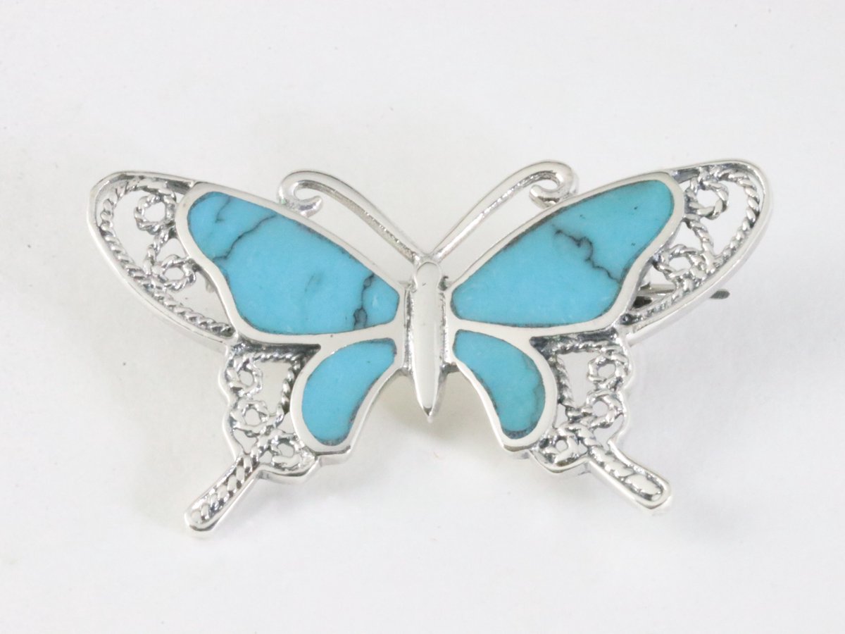 Zilveren vlinder broche met blauwe turkoois