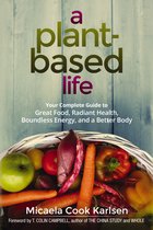 Boek 'A Plant-Based Life' met mand vol groenten en fruit.