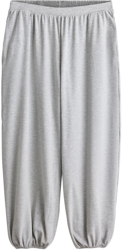 Grijze jersey broek met ballonpijpen.