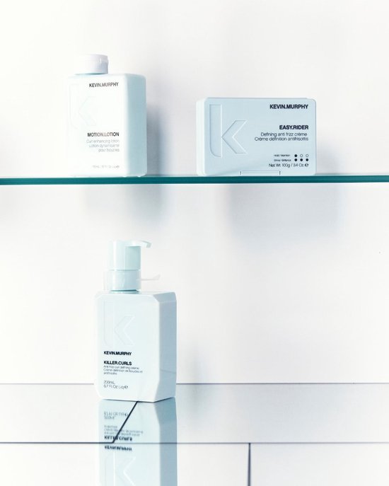 Drie lichtblauwe flacons van KEVIN.MURPHY: Motion.Lotion, Easy.Rider en Killer.Curls.