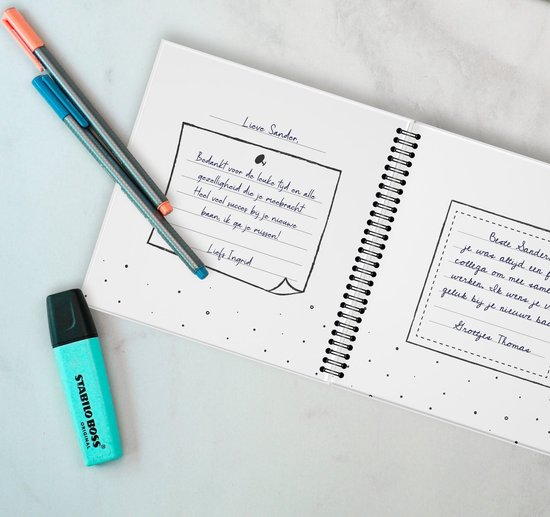 Een open boek met een handgeschreven tekst: 'Bedankt voor de leuke tijd en gezelligheid die je mebracht. Heel veel succes bij je nieuwe baan, ik ga je missen! Liefs Ingrid.'
