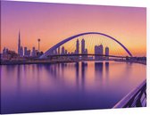 Zonsopkomst zorgt voor een paarse gloed in Dubai - Foto op Canvas - 150 x 100 cm