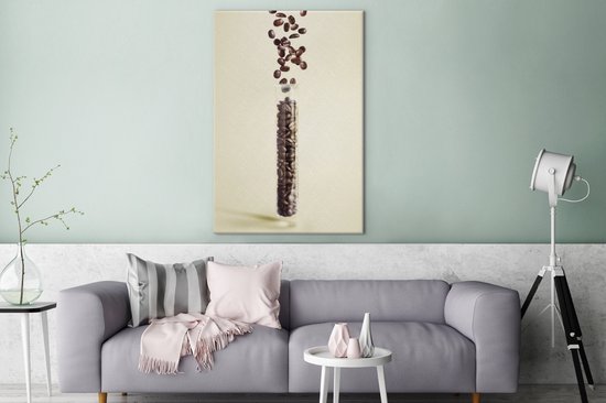 Tableau sur toile Chute de grains de café dans un tube - 80x120 cm - Décoration murale