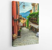 Canvas schilderij - Amazing old narrow street view, famous picturesque cobblestone street with souvenir shops, restaurants and cafes in Bellagio touristic resort, Lake Como, Italy,