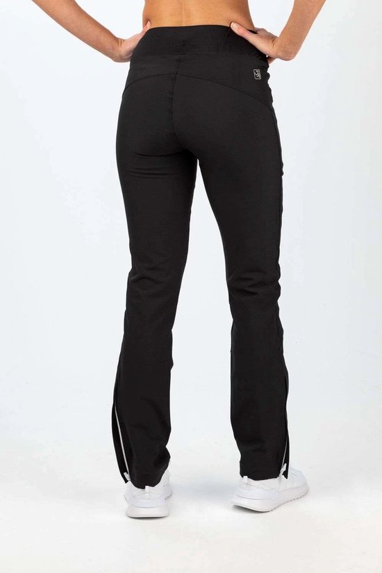Zijaanzicht van een zwarte stretch trainingsbroek voor dames met witte ritsdetails en enkelritsen.