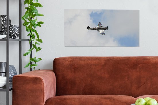 Tableau sur toile Avion Spitfire dans un ciel nuageux - 80x40 cm - Décoration murale
