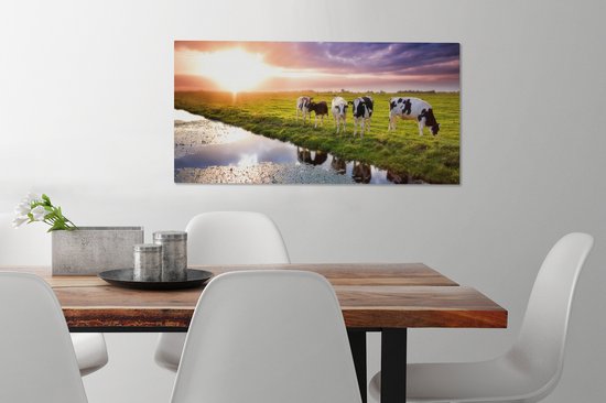 Tableau sur toile Vaches pendant un coucher de soleil - 80x40 cm - Décoration murale Art