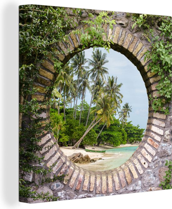 Tableau sur toile Un palmier sur la plage est suspendu au-dessus de la