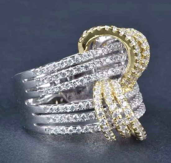 Bague bicolore avec des bandes dorées et argentées, serties de zircons.