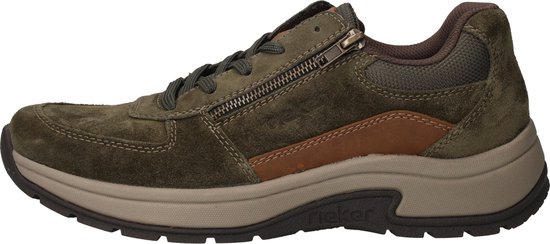 Zijaanzicht van groene suède sneaker met bruine leren accenten en ritssluiting.
