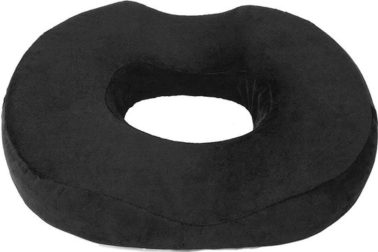 Zwart fluwelen donut zitkussen met een ergonomische vorm.