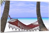 WallClassics - Tuinposter – Rode Ibiza Hangmat op Tropisch Strand - 150x100 cm Foto op Tuinposter (wanddecoratie voor buiten en binnen)