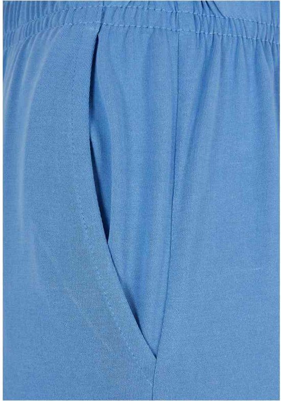 Sluiting van de zijzak van een lichtblauwe culottebroek.