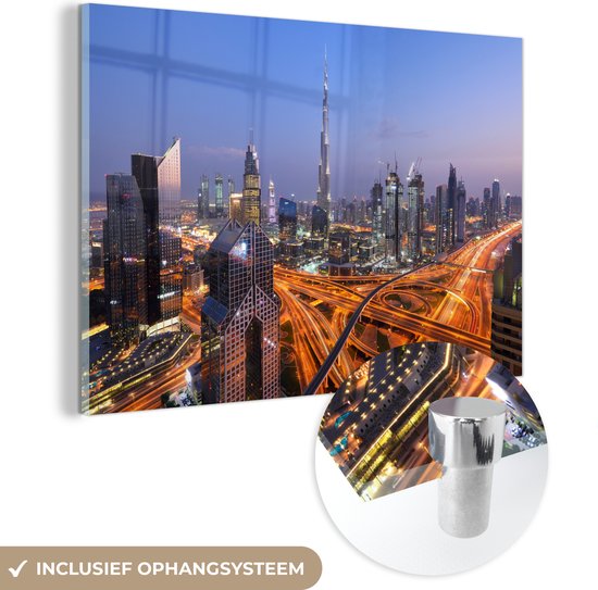 MuchoWow® Glasschilderij 120x80 cm - Schilderij acrylglas - De vele neonlichten van Dubai met als middelpunt de Burj Khalifa - Foto op glas - Schilderijen
