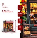 Miniatuur 'Uncle Joe's Pizzeria' met afmetingen, aantal onderdelen en LED-verlichting.