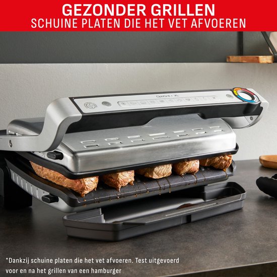 Tefal contactgrill met vier hamburgers die gegrild worden op de schuine platen, met afdruipend vet.