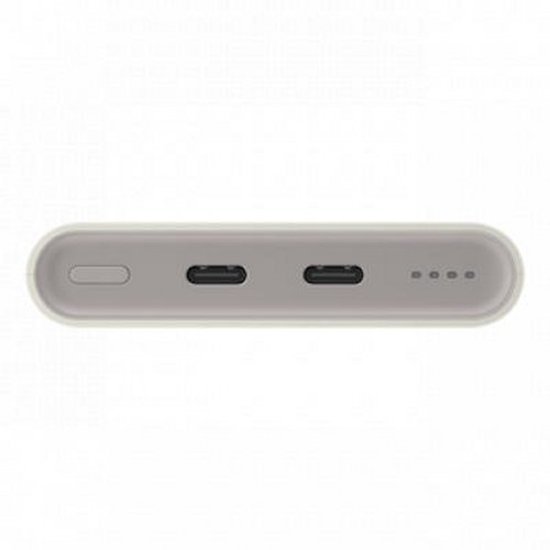 Zijaanzicht van de lichtgrijze powerbank met twee USB-C poorten.