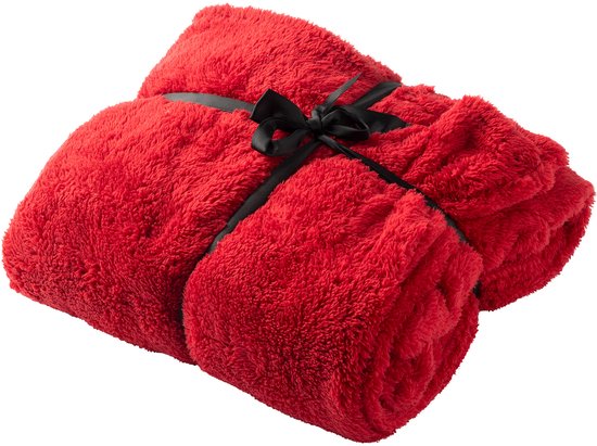 Opgerolde rode fleece deken gebonden met een zwarte strik.