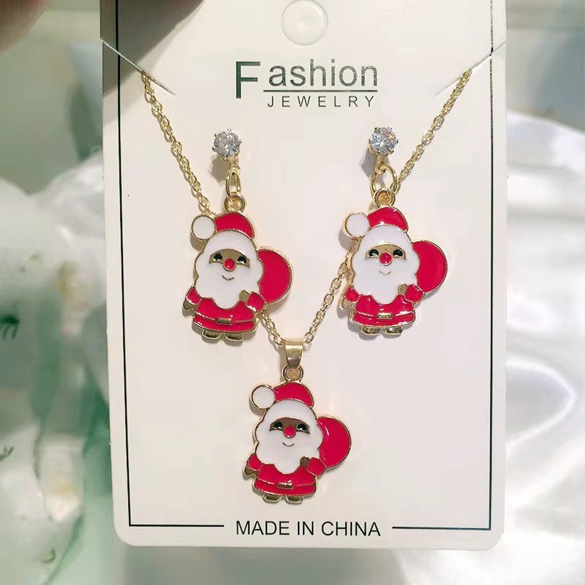 Kerstman sieraden set ketting + oorbellen | rood goud gekleurd