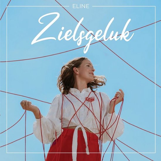 Vrouw met witte blouse en rode broek, omringd door rode draden, met de tekst "ZIELSGELUK".