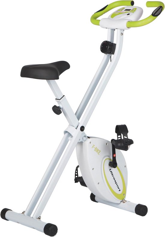 Witte en groene opvouwbare hometrainer, gefotografeerd op een witte achtergrond, met een zwart zadel en pedalen.
