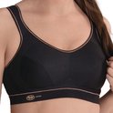 Zwarte sportbeha met koperkleurige biezen, gedetailleerde cups en Anita Active logo.