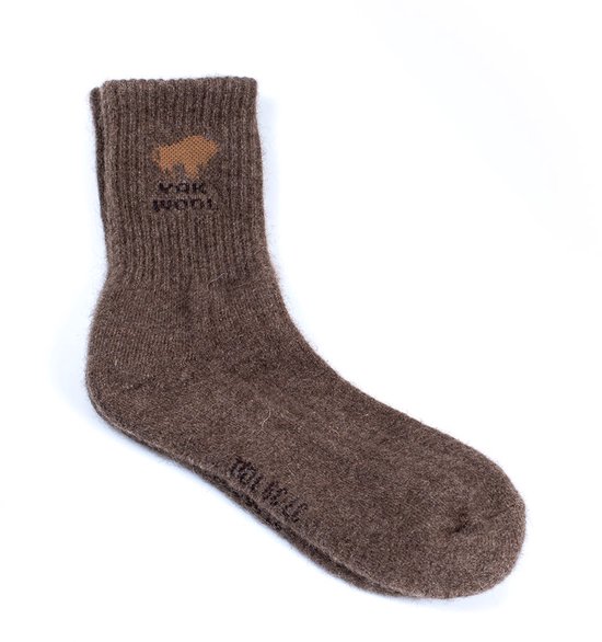 Bruine wollen sok met opdruk 'WAK WOOL' en een bizon-afbeelding.