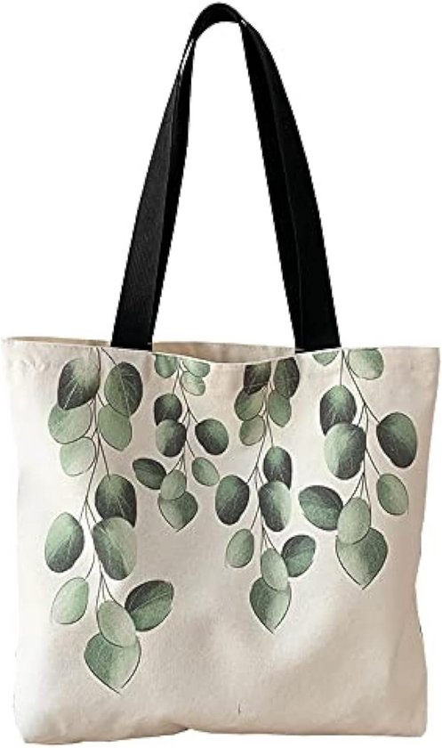 Sac fourre-tout en toile crème avec anses noires et imprimé de feuilles d'eucalyptus vertes pendantes.