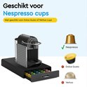 Boîte noire pour capsules, tiroir ouvert rempli de capsules colorées, indiquant qu'elle est pour les capsules Nespresso.