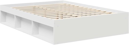 Wit bedframe met opbergvakken en houten lattenbodem, vanuit een hoek bekeken.