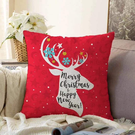 Rood kussen met wit rendiersilhouet, sneeuwvlokken, sterren en de tekst Merry Christmas & Happy New Year.