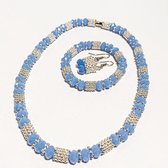 Blauwe sieradenset met kristallen , set van drie. Ketting, armband en oorbellen