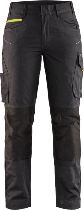 Pantalon de travail gris foncé avec accents jaune fluo, genoux renforcés et poches.