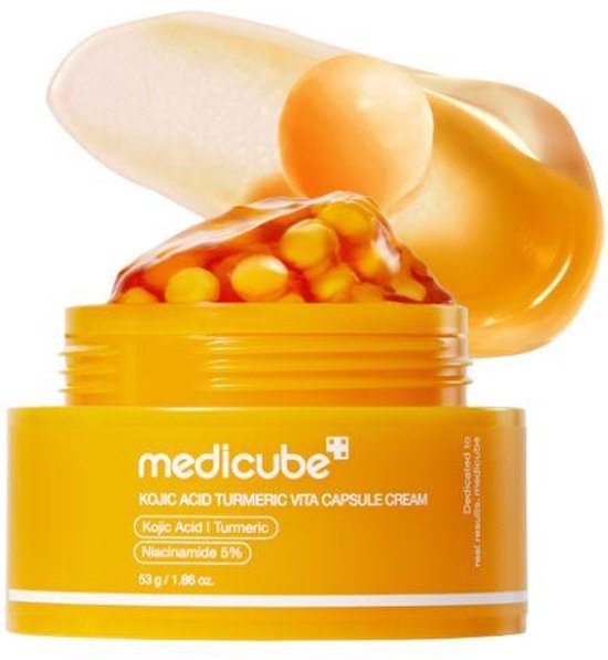 Medicube KOJIC ACID TURMERIC VITA CAPSULE CREAM pot met oranje capsules en gele crème.