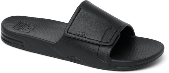 Zwarte Reef slipper met klittenband en Reef logo op voetbed.