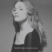 Madonna met lang, golvend blond haar en een zwarte jurk. Tekst: MADONNA veronica electronica.